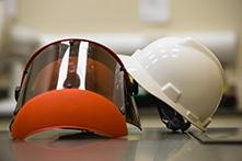 A white helmet and an orange face shield.